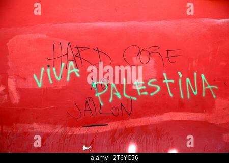 Viva Palestina / Long live Palestine graffiti sprayed on a red wall in protest against Israeli military offensive in Gaza, La Paz, Bolivia. Photo taken in 2016. Stock Photo
