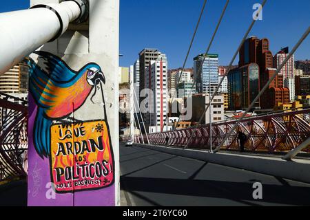 La Paz, Bolivia, 7th July 2022: A mural on a pillar of the Puente Gemelo / Twin Bridge of a blue and yellow macaw protesting against chaqueos / fires started deliberately to clear the tropical forests of he Chiquitania and Amazon regions of the Bolivian lowlands. Deforestation has become a huge problem in Bolivia in the last decade in particular; in 2022, Global Forest Watch placed Bolivia third in the world for primary forest loss. Much of the deforestation is government policy to expand the country's agricultural frontier to produce soya and cattle for export to especially China. Stock Photo