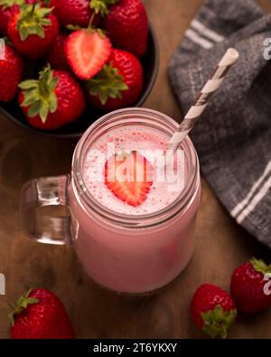 High angle strawberry milkshake with straw Stock Photo
