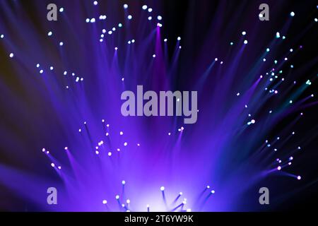 Purple fiber optics lights abstract background Stock Photo