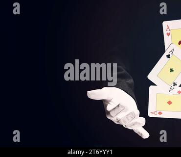 Close up magician doing trick with playing cards Stock Photo