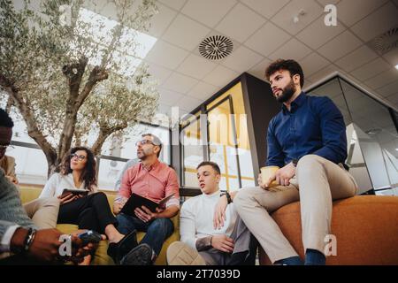 Diverse colleagues in a modern office engage in creative brainstorming, fostering effective teamwork and innovation. Stock Photo