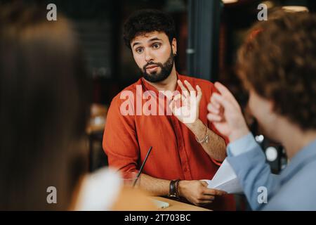 Successful Collaboration: Architects and Engineers Working Together on Urban Planning Project Stock Photo