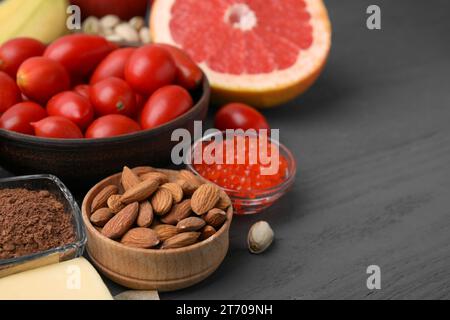 Many different products on grey wooden table, closeup. Natural sources of serotonin Stock Photo