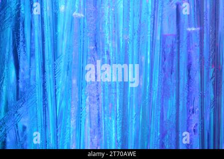 Optical fiber strands transmitting blue light, macro view Stock Photo