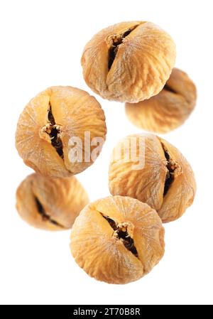 Many dried figs falling on white background Stock Photo