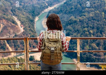 Girl tourist enjoy an aerial view of the Teesta river valley from Lover's point at Darjeeling, India Stock Photo