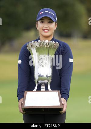 Mao Saigo of Japan holds the trophy after winning the Ito En 