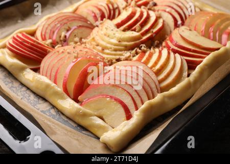 Uncooked apple galette with nuts on baking tray, closeup Stock Photo