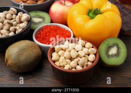Many different products on wooden table, closeup. Natural sources of serotonin Stock Photo