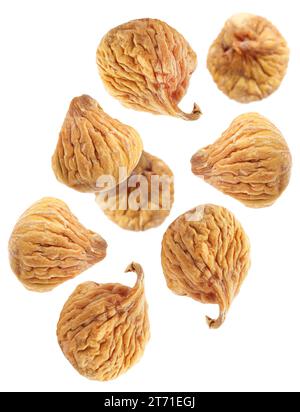 Many dried figs falling on white background Stock Photo
