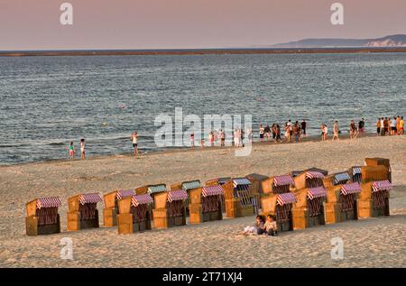 Wicker chairs at sunset on Baltic Sea beach in Swinoujscie at Uznam Island in Pomerania, West Pomeranian Voivodeship (Zachodniopomorskie), Poland Stock Photo