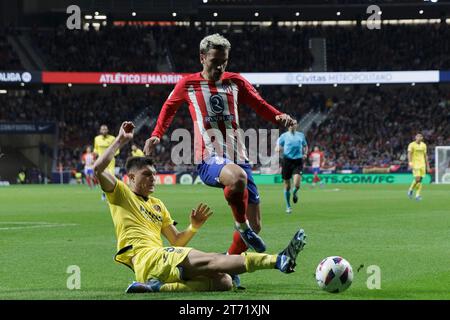 Madrid, Spain. 12th Nov, 2023. Antoine Griezmann of Atletico de Madrid and Jorge Cuenca of Villarreal in action during the La Liga 2023/24 match between Atletico de Madrid and Villarreal at Civitas Metropolitano Stadium. Final score; Atletico de Madrid 3:1 Villarreal (Photo by Guillermo Martinez/SOPA Images/Sipa USA) Credit: Sipa USA/Alamy Live News Stock Photo