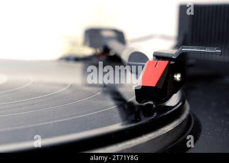 Detail of a vintage turntable playing a vinyl, shallow depth of field Stock Photo