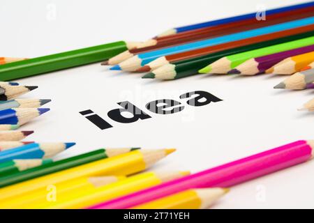Detail view of many colored pencils arranged around the word idea; Detail view of many colored pencils arranged around the word idea Stock Photo
