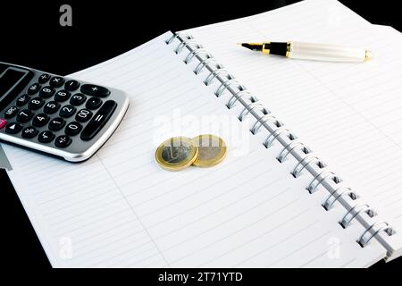 Close-up of calculator, pen, notepad and money; Close-up of calculator, pen, notepad and money Stock Photo