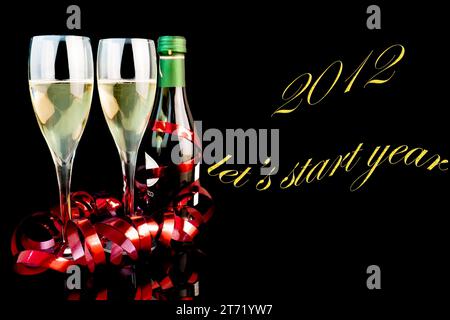 detail of two glasses near a middle bottle of champagne on black background with space for text; detail of two glasses near a middle bottle of champagne on black background with space for text Stock Photo