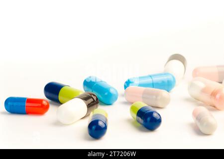 detail of many colorful pills on white background with space for text Stock Photo
