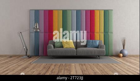 Colorful fabric paneling in a modern room with gray sofa on hardwood floor - 3d rendering Stock Photo