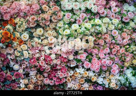 Rose artificial flowers are marked by hand. It's decoration. Stock Photo