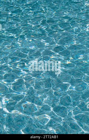 Clear reflection of sunlight on blue water in a pool Stock Photo