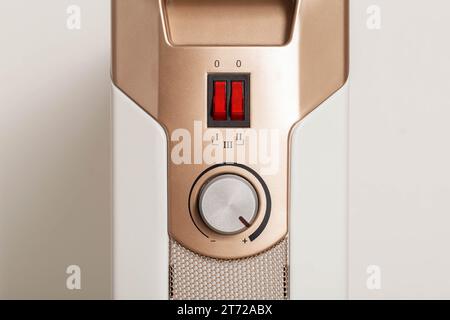 heating temperature control panel, heater on and off buttons. The concept of indoor heating with electricity. Stock Photo