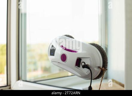 Clean windows safely with a window cleaning robot. Stock Photo