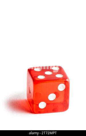 close up of a red dice on white background with space for text Stock Photo