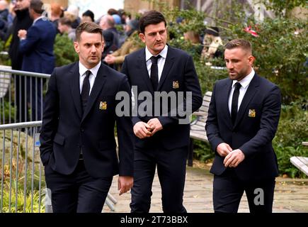 Manchester United players Tom Heaton, Harry Maguire and Luke Shaw arrive ahead of the funeral service for Sir Bobby Charlton at Manchester Cathedral, Manchester. Manchester United and England great Sir Bobby Charlton died aged 86 in October. Charlton scored 249 goals for Manchester United, and helped them win three league titles, an FA Cup, and the European Cup in 1968. At international level, he was a part of the England team which won the World Cup in 1966. Picture date: Monday November 13, 2023. Stock Photo