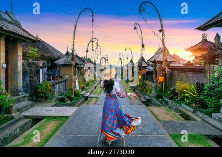 Tourist walking at Penglipuran village is a traditional oldest Bali village in Bali, Indonesia. Stock Photo