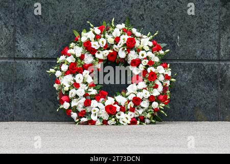 Manchester, UK. 13th Nov, 2023. A wreath laid in front of The Trinity Statue on the day of the funeral of Sir Bobby Charlton passes by Old Trafford, Manchester, England on Monday 13 November, 2023. (Photo by Phil Bryan/Alamy Live News) Stock Photo