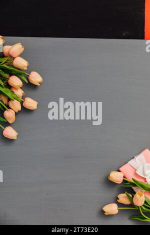 tulip flowers on a gray wooden background for the holiday Stock Photo