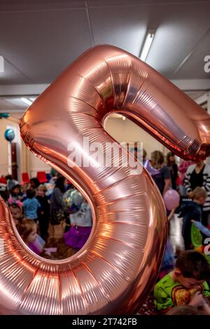 Number 5, gold helium balloon at a children's 5th birthday party Stock Photo