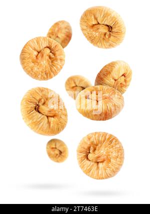 Many dried figs falling on white background Stock Photo