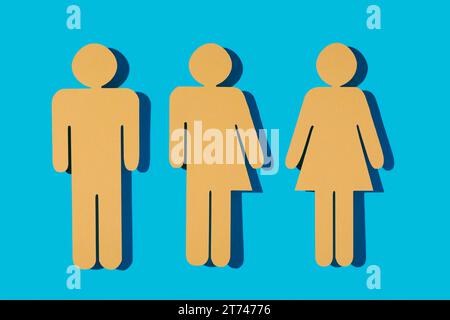 three yellow gender icons on a blue background, a male gender icon, a gender neutral icon and a female gender icon Stock Photo