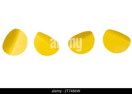 Round yellow stickers, blank tags labels isolated on a white background. Top view. Stock Photo