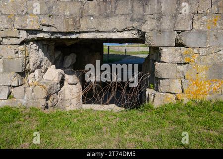 Close up of a bunker and barbed wire at pointe du hoc, Normandy, France Stock Photo