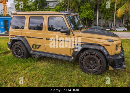 Beautiful view of G-Wagen Brabus SUV parked on a green lawn in Miami Beach. USA. Stock Photo