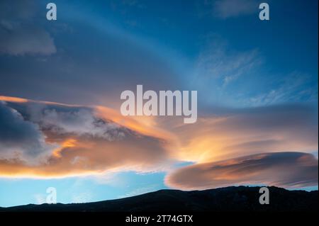 Sky and clouds at sunrise in Asinau, GR20, Corsica, France Stock Photo