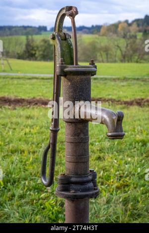 Old water pump in an old farmes village Stock Photo