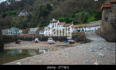 Fishing boats left high and dry at low tide in the harbour at Lynmouth, North Devon, Devon, England, UK Stock Photo