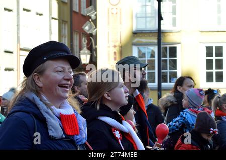 GDANSK, POLAND - 11 NOVEMBER 2023: Poles sing the national anthem on Ulica Długa for Polish Independence Day in the Old Town. Stock Photo