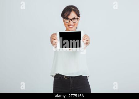 Businesswoman posing with tablet Stock Photo