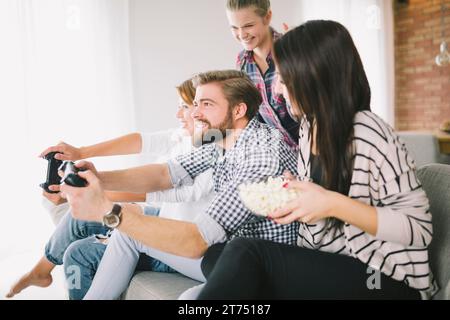 Cheerful people playing game party Stock Photo