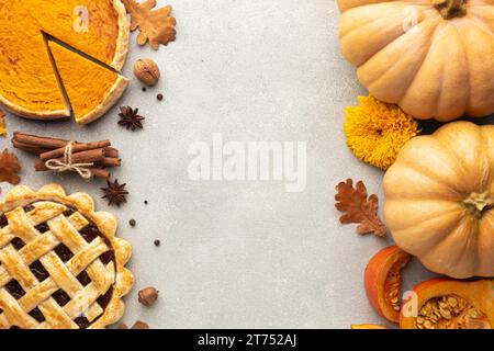 Flat lay decoration with pumpkins stucco background Stock Photo