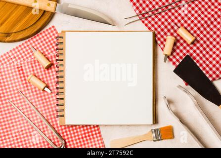 Blank notebook grilling tools Stock Photo