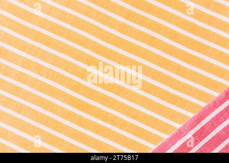 Red fabric yellow white stripes textile tablecloth Stock Photo