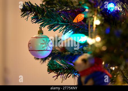 Christmas Tree Decorations and Lights. Festive holiday decorations on a Christmas tree. Stock Photo