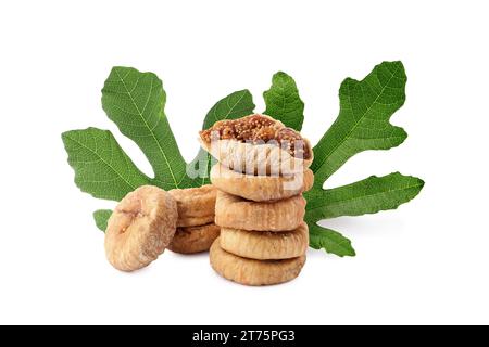 Dried figs and green leaves isolated on white Stock Photo