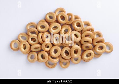 Group of small bagels on a white background, top view Stock Photo